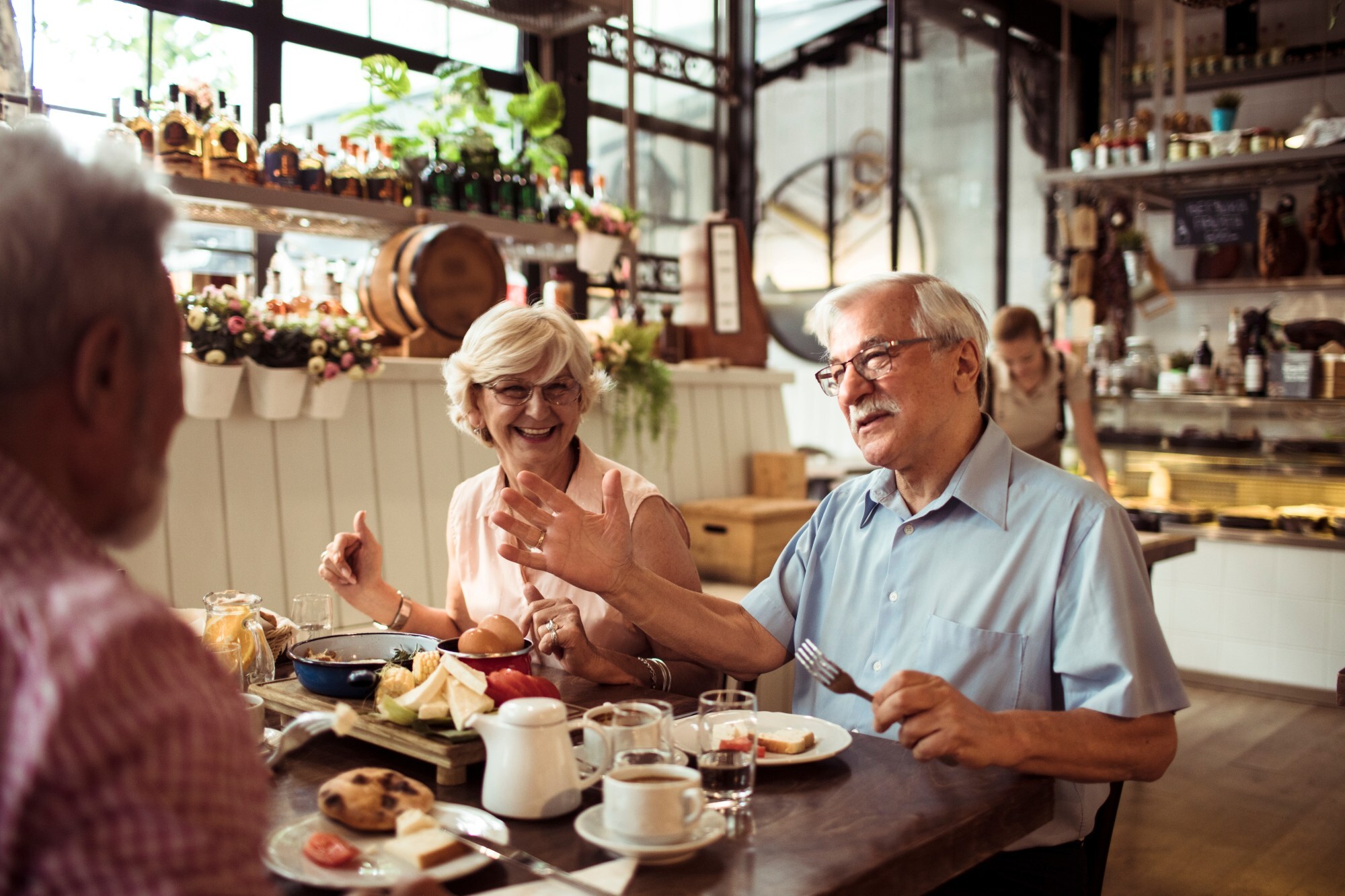 shutterstock_2523997905 people eating at table